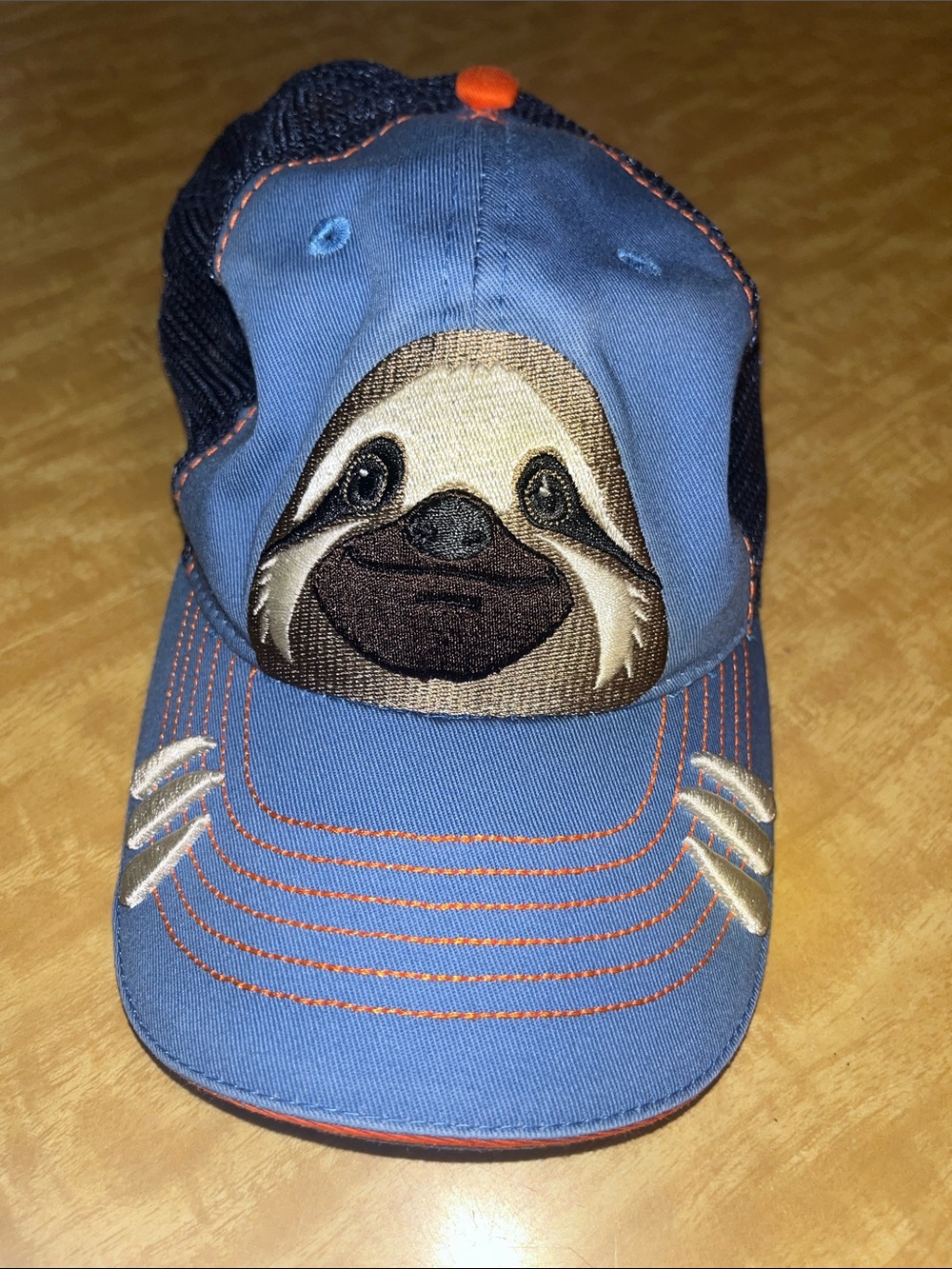 Pura Vida Light Blue Kids Trucker Hat w/ Orange Trim and Embroidered Sloth OS